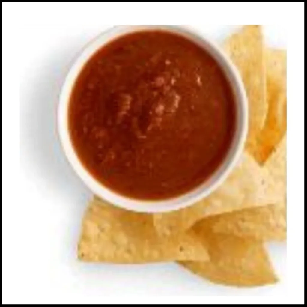 Chipotle Chips & Tomatillo-Red Chili Salsa – Crispy chips with spicy salsa. A serving of Chipotle's crispy tortilla chips accompanied by spicy tomatillo-red chili salsa.