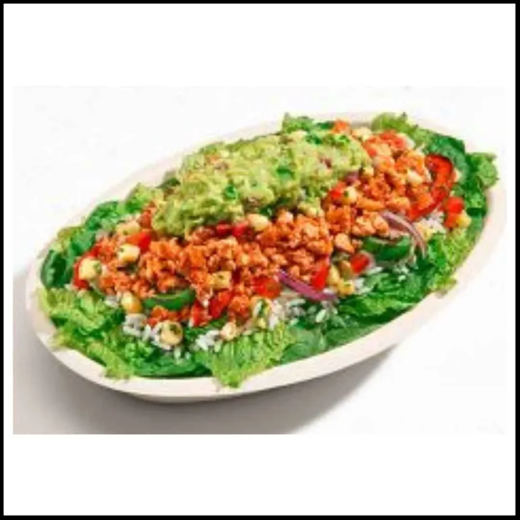 Chipotle Plant Powered Bowl – A Delicious Vegan-Friendly Meal! Chipotle Plant Powered Bowl with seasoned plant-based protein, cilantro-lime rice, fresh lettuce, corn salsa, grilled peppers, and guacamole.