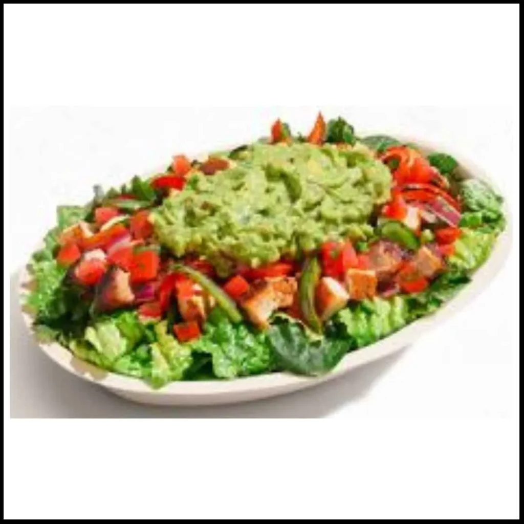 Chipotle Wholesome Bowl – A Fresh and Nutritious Lifestyle Choice! Chipotle Wholesome Bowl featuring grilled chicken, fresh lettuce, bell peppers, tomatoes, and a generous scoop of guacamole.
