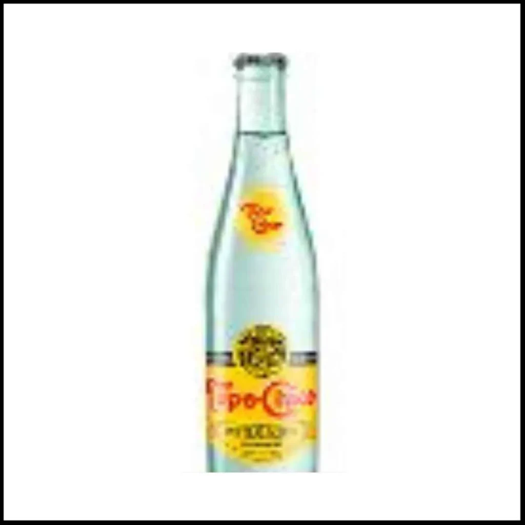 Topo Chico Mineral Water – Sparkling Refreshment in a Glass Bottle A clear glass bottle of Topo Chico Mineral Water with a yellow and red label.